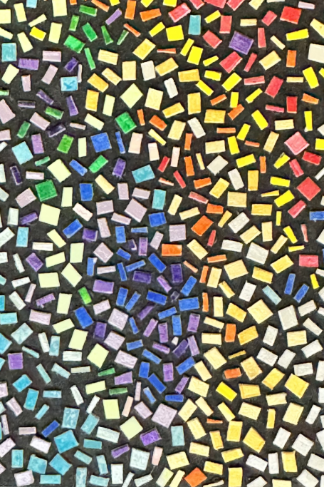 Colorful mosaic tiles arranged in a vibrant, abstract pattern.